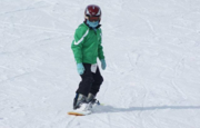 Image of a snowboarder going downhill